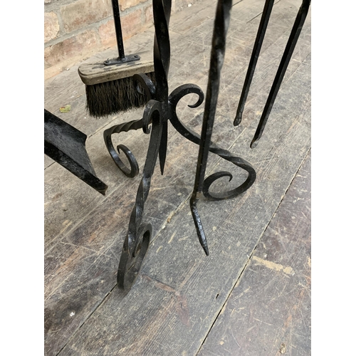 1294 - Regency wrought iron fireside companion set with shovel, brush, poker & tongs. H 78cm.