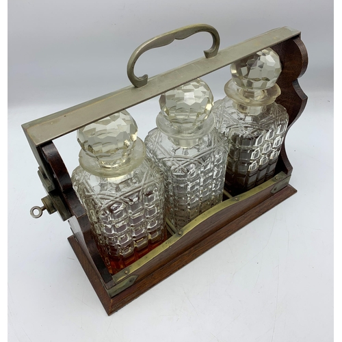 2341 - Antique Oak Wood Three Bottle Tantalus With Crystal Decanters & Key