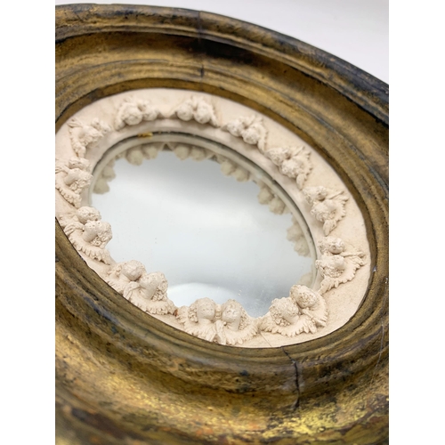 1062 - Victorian Miniature Plaster Mirror With Cherub Border Design. 23 x 19cm.