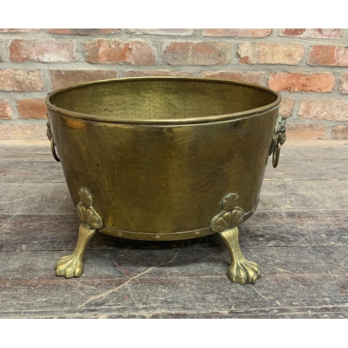 2383 - Antique brass paw footed and twin lion head handled coal or log bucket. W 42cm x H 30cm.