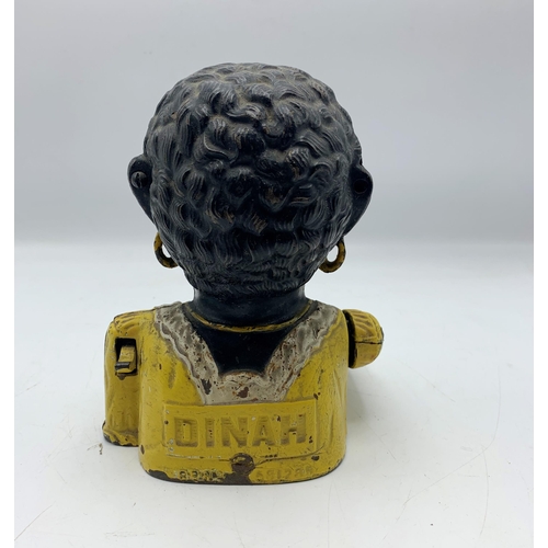 2389 - Unusual female Jolly Negro cast iron money bank.