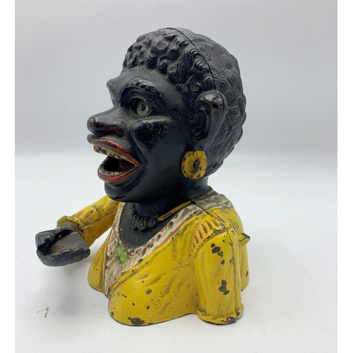 2389 - Unusual female Jolly Negro cast iron money bank.