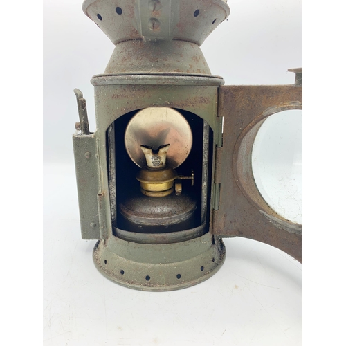 1093 - C Eastlake and Sons Green Railroad Lantern With Military Crow Foot Markings. H 32cm.