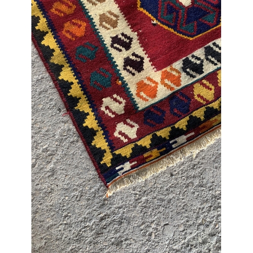 1434 - Good quality Persian Qashgai kilim, ten medallions on red ground, 250 x 140cm