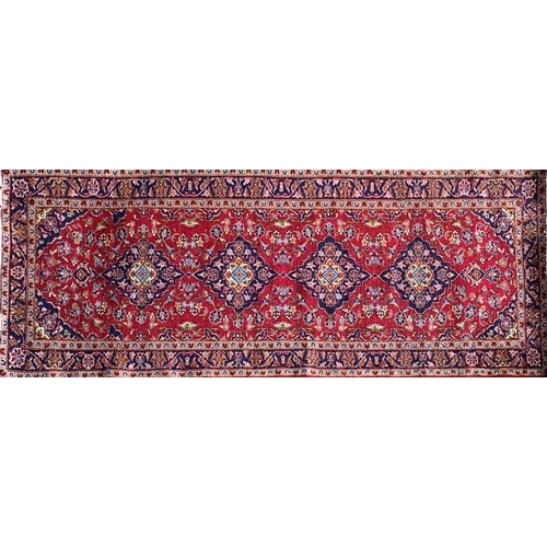 1437 - Persian Kashan runner, traditional four medallion design on red ground, 290 x 100cm