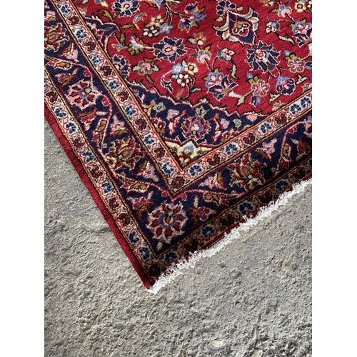 1437 - Persian Kashan runner, traditional four medallion design on red ground, 290 x 100cm