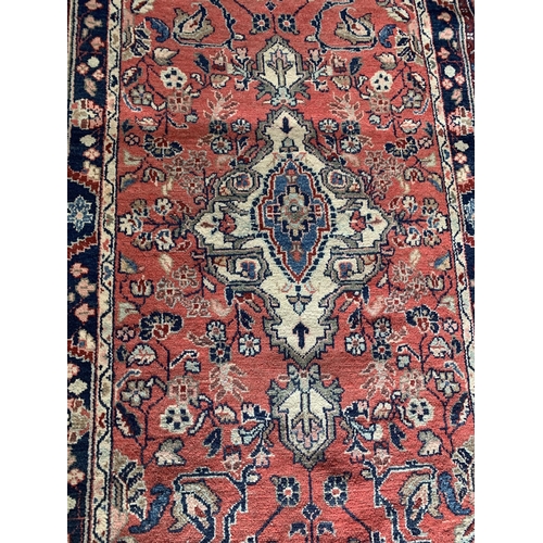 1441 - Good Persian Sarouk Mahal runner, traditional floral decoration on a washed red and blue ground, 320... 