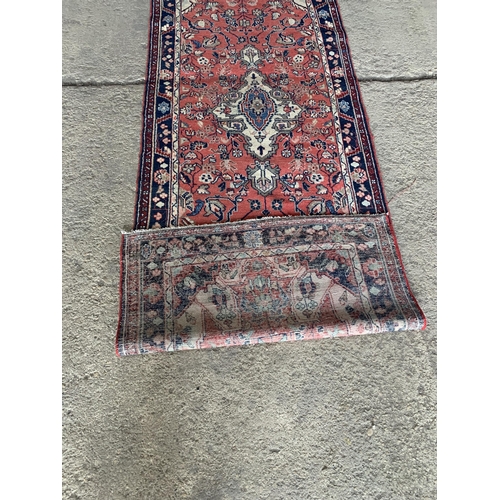 1441 - Good Persian Sarouk Mahal runner, traditional floral decoration on a washed red and blue ground, 320... 