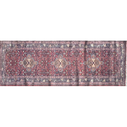 1445 - Good Persian Malayer runner, intricate three medallion design on washed red ground, 285 x 90cm