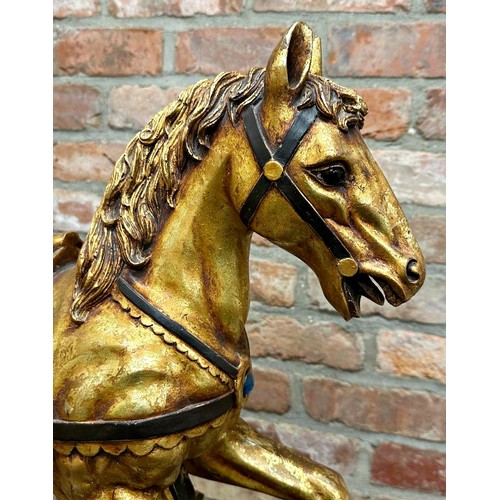 335 - Decorative gilt carousel type rocking horse on stand, 96cm high x 56cm wide