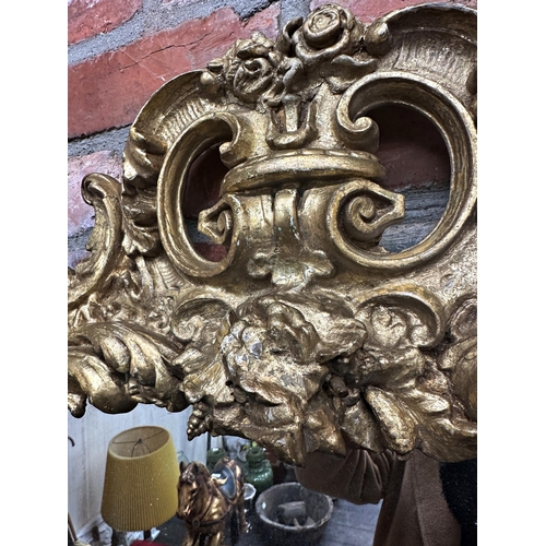 1075 - Good 19th century carved giltwood and gesso rococo wall mirror, original glass, 92 x 47cm