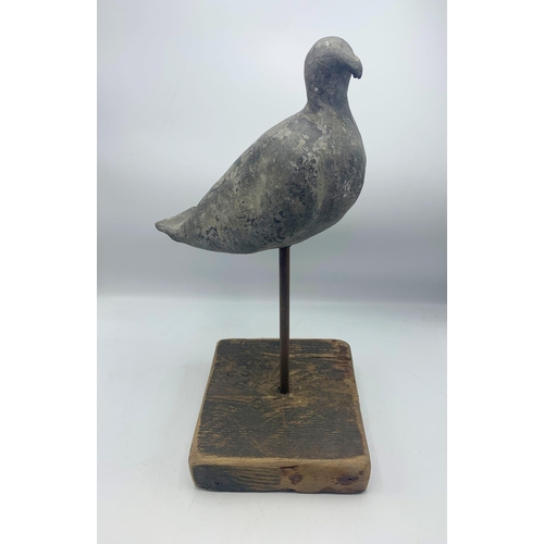 2388 - Antique estate made lead decoy pigeon raised on a wood block stand, H 49cm