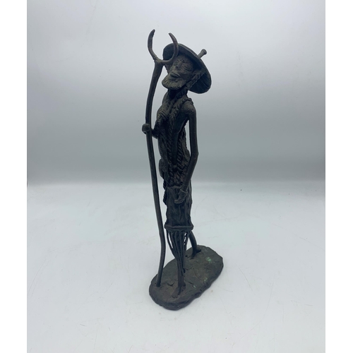 2261 - Antique Benin style bronze figure of a farmer, H 39.5cm