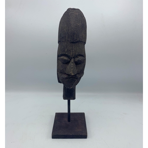 2272 - Carved Wooden African Tribal Head Mounted Atop Wooden Base. H 34cm.