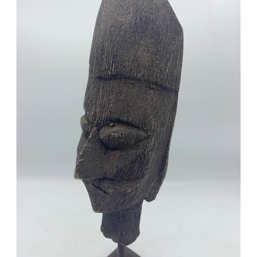 2272 - Carved Wooden African Tribal Head Mounted Atop Wooden Base. H 34cm.