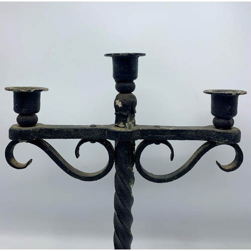 1111 - Twisted stem wrought iron three sconce candelabra piece. H 42cm W 29cm.