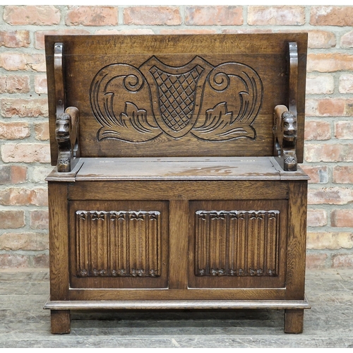 1307 - Carved oak fold over top monk's bench with box base, H 74cm x W 92cm x D 47cm