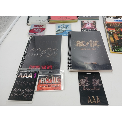 39 - A collection of itineraries and passes from tours by AC/DC consisting of:- The Razors Edge tour, 199... 