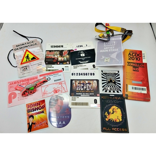 57 - A collection of band tour related paper passes including Glastonbury 2013 wristbands and vehicle pas... 