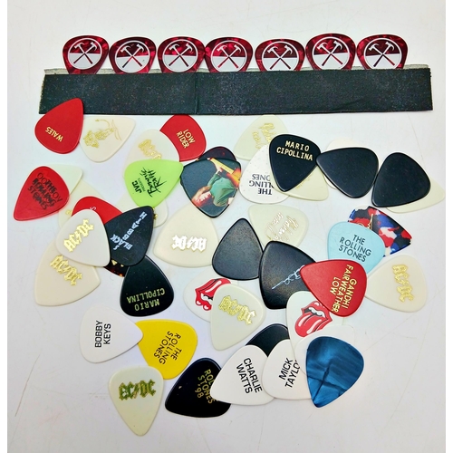 78 - A large collection of 53 guitar pics from many great named guitar players including Eric Clapton, Ke... 