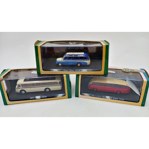 287 - Collection of vintage boxed vehicles to include cars, buses & trams (9)