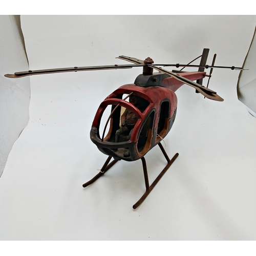 318 - Large wooden scratch built helicopter with metal propellers. L 65cm x H 30cm.