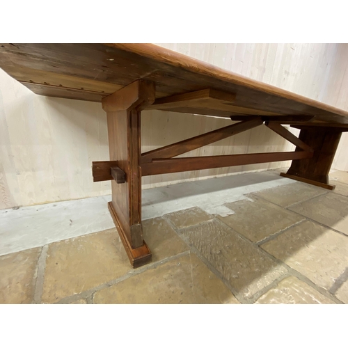 1266 - Good Arts and Crafts type pitch pine refectory table with arched stretcher, H 74cm x W 302cm x D 101... 