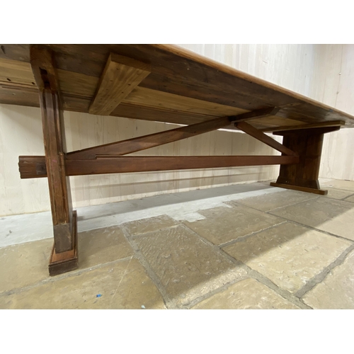 1266 - Good Arts and Crafts type pitch pine refectory table with arched stretcher, H 74cm x W 302cm x D 101... 