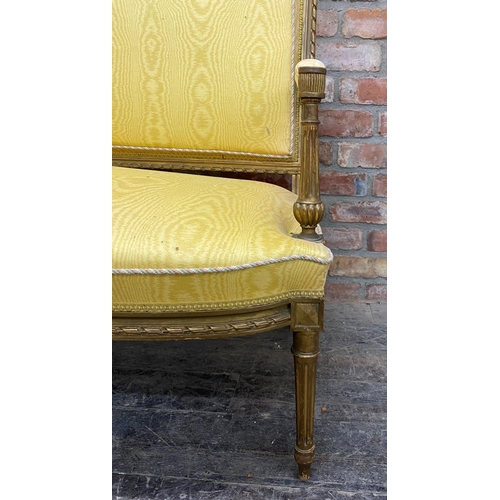 1268 - Louis XVI gilt wood and gesso salon couch, recently upholstered with marbled yellow fabric and pipin... 