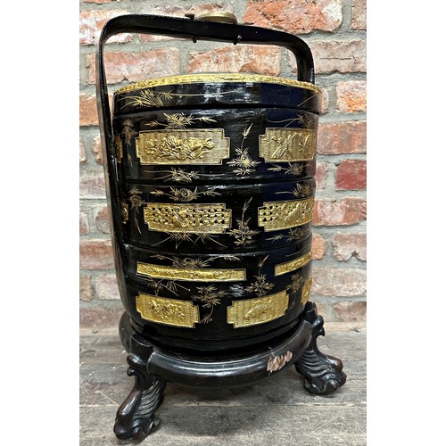 2273 - Good Chinese four tier lacquered wedding basket, with gilt overlay, on a well carved stand, 65cm hig... 