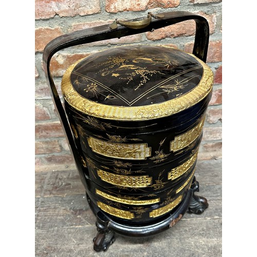 2273 - Good Chinese four tier lacquered wedding basket, with gilt overlay, on a well carved stand, 65cm hig... 