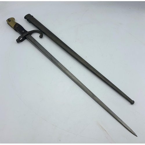 2415 - French 1874 pattern Gras bayonet with steel scabbard, the blade spine dated 1877 with makers mark, t... 