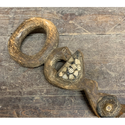 2315 - Good ceremonial tribal staff, hoop handle over a carved bird inlaid with shells, 90cm long