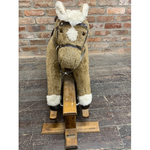 320 - Large Mamas & Papas children's rocking horse with wooden base & leather saddle. L 90cm x H 80cm