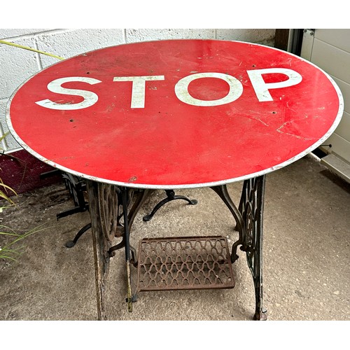 1030 - Bespoke occasional table, with cast iron Singer treadle base and enamel STOP road sign top, 72cm hig... 