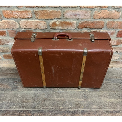 2428 - Four large vintage suitcases to include two vellum examples one with exotic travel stickers and a ba... 