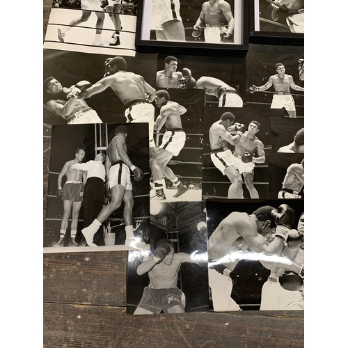 432 - A good quality collection of Muhammad Ali press release photographs for his bouts with Henry cooper ... 