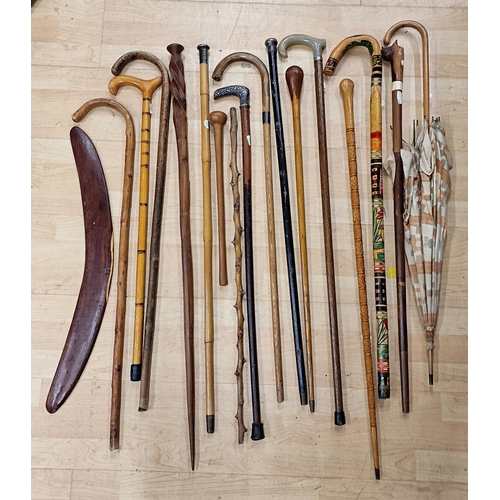 2318 - Large collection of walking sticks to include two silver topped examples with an Art Deco parasol an... 