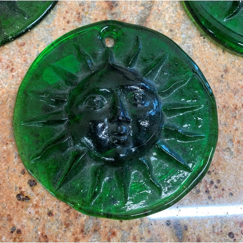 2239 - George Elliott Bewdley Studio Glass bowl with three George Elliot Bewdley green glass sun face plaqu... 