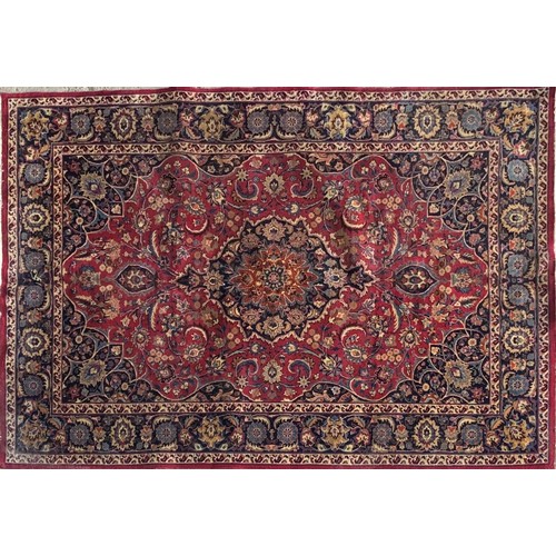 1429 - Good Persian Meshed carpet, central blue medallion and red ground, 290 x 200cm