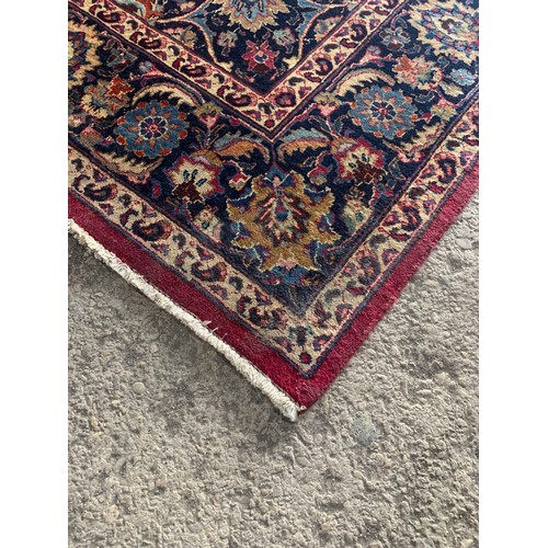 1429 - Good Persian Meshed carpet, central blue medallion and red ground, 290 x 200cm