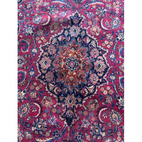 1429 - Good Persian Meshed carpet, central blue medallion and red ground, 290 x 200cm