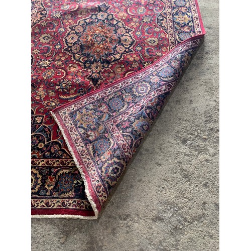 1429 - Good Persian Meshed carpet, central blue medallion and red ground, 290 x 200cm