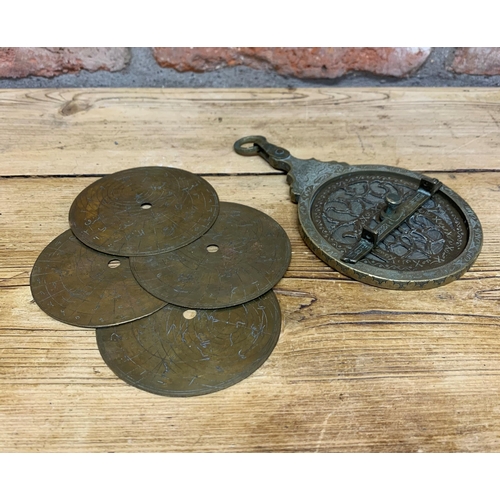 Antique Islamic brass astrolabe instrument, engraved throughout having ...