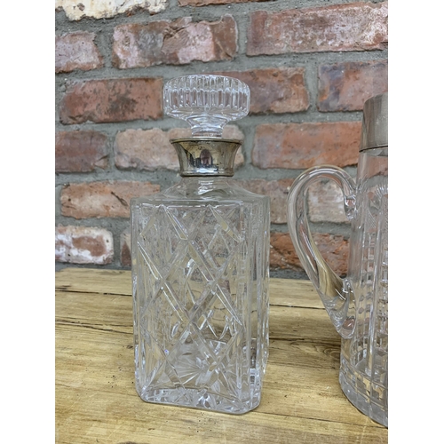 178 - Two silver collared decanters with additional silver rimmed jug (3)