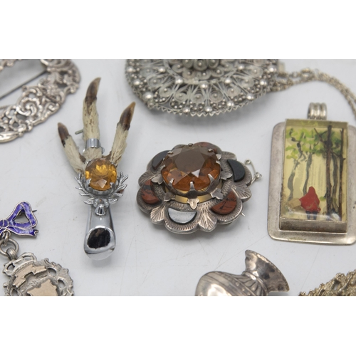 59 - Mixed collection of Scottish silver and similar brooches and pendants (8)