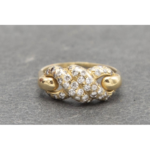 82 - 18ct Cartier diamond knot ring, size N, 4.5g, with Cartier insurance valuation for £2490 dated 1985,... 