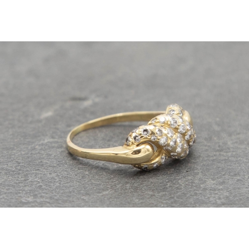 82 - 18ct Cartier diamond knot ring, size N, 4.5g, with Cartier insurance valuation for £2490 dated 1985,... 