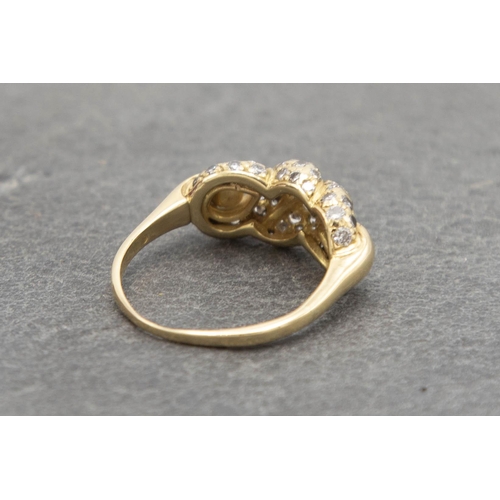 82 - 18ct Cartier diamond knot ring, size N, 4.5g, with Cartier insurance valuation for £2490 dated 1985,... 