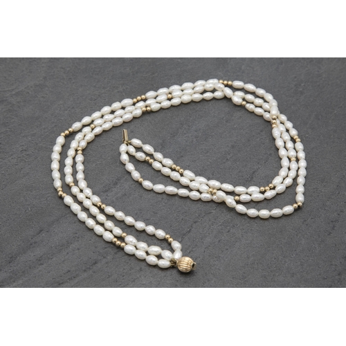 83 - Vintage 9ct and freshwater pearl three strand necklace, 43cm long